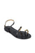 Black sandal with gold accents on a white background