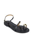 Black sandal with gold accents on a white background