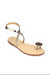 Beige sandal with decorative straps on a white background